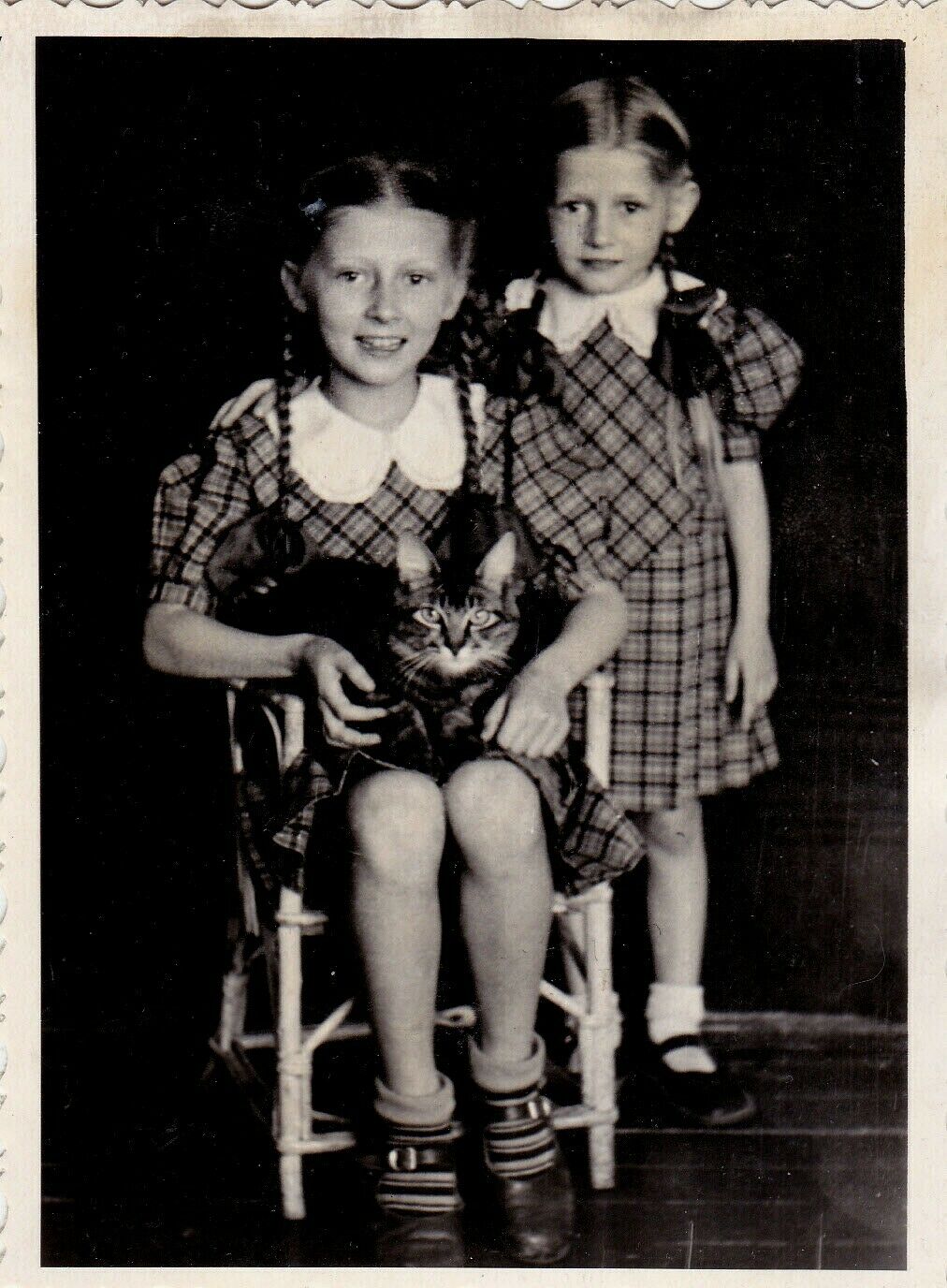 1955-Cute-little-girls-pigtails-braids-cat-pet.jpg