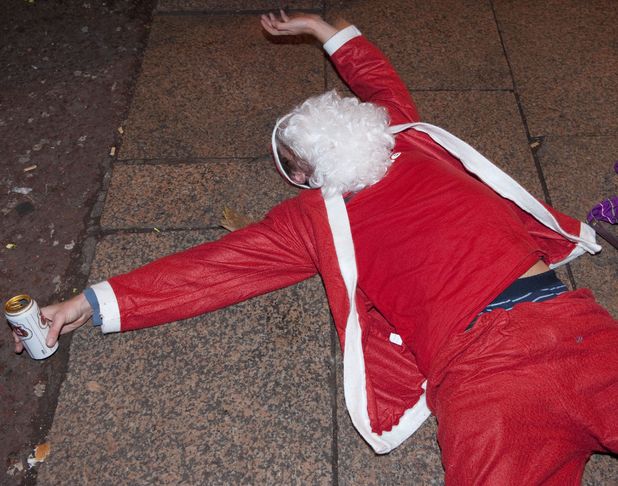 drunk-santa-lying-on-the-ground-
