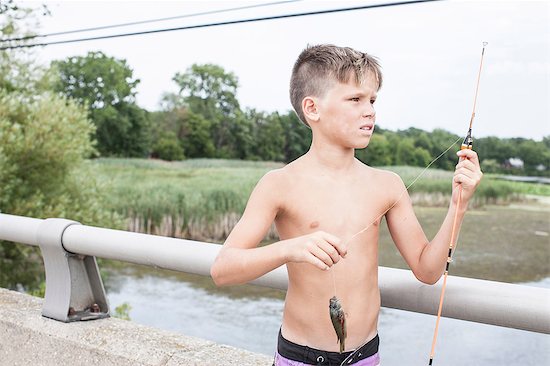 Boys with fishing rod and caught