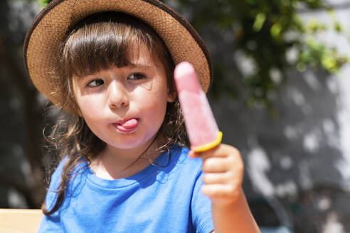 portrait-of-little-girl-eating-homemade-strawberry-ice-cream-GEM